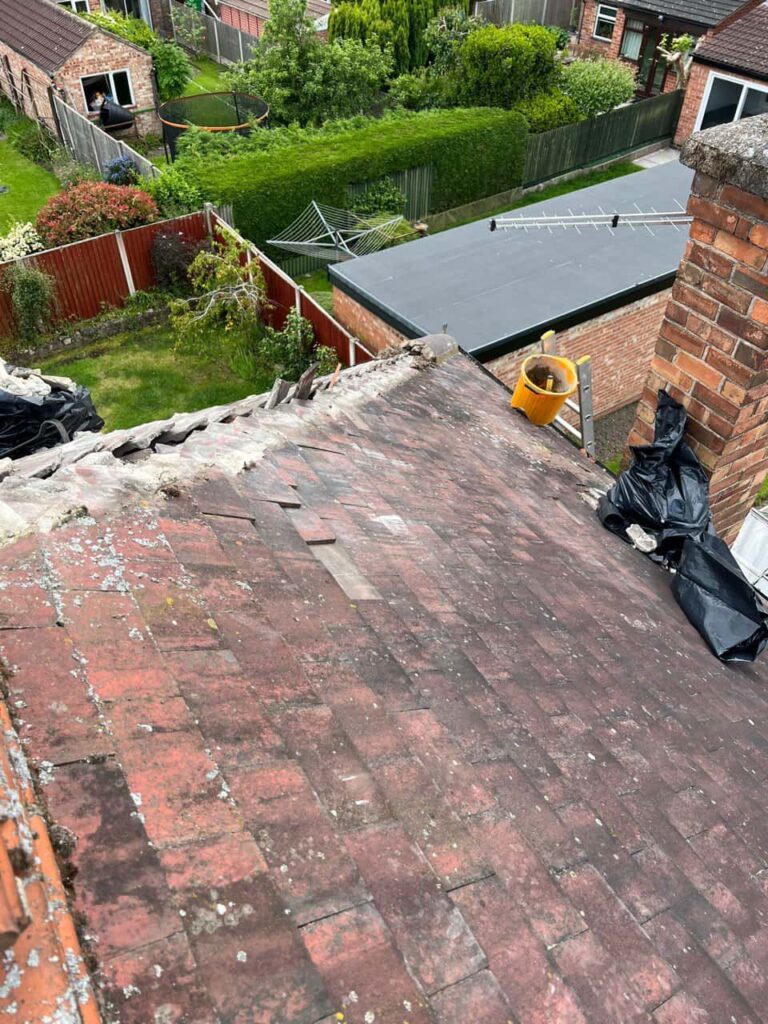 This is a photo of a roof where the hip tiles have been removed, and are just about to be replaced. Works carried out by LS Roofing Henley-on-Thames